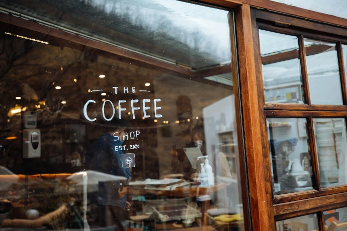 a store front with a sign that says the coffee shop